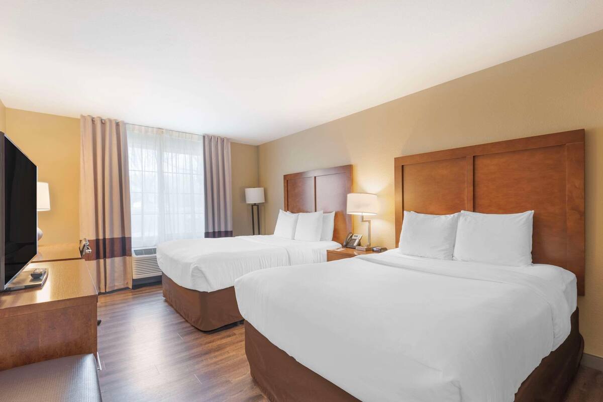 Premium bedding, desk, laptop workspace, iron/ironing board