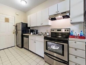 Deluxe Studio, 1 King Bed, Accessible | Private kitchen | Full-sized fridge, microwave, coffee/tea maker