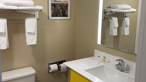 A bathroom with a toilet, sink, and towel rack. - Days Inn by Wyndham Gettysburg (Gettysburg)