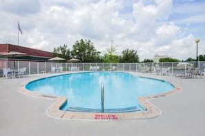 Seasonal outdoor pool, open 10:00 AM to 8:00 PM, pool loungers