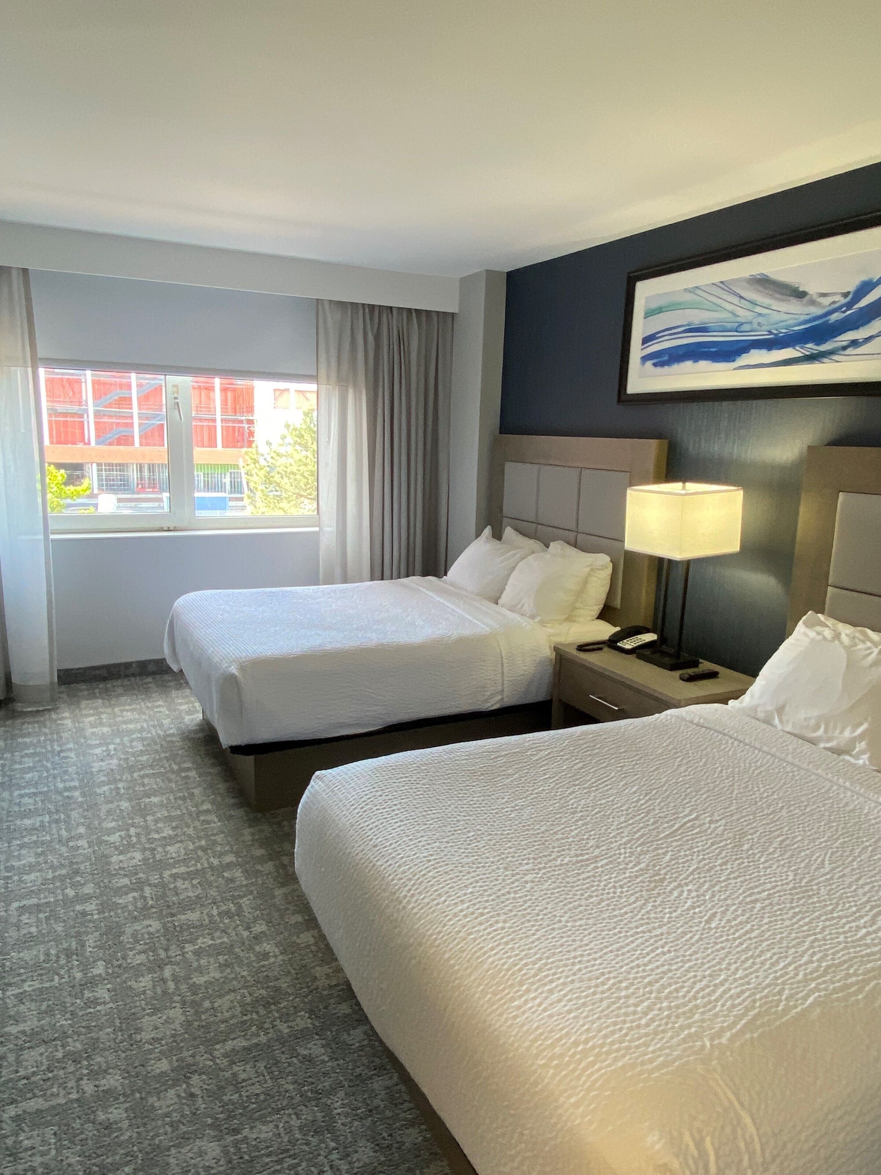 1 bedroom, premium bedding, laptop workspace, blackout curtains