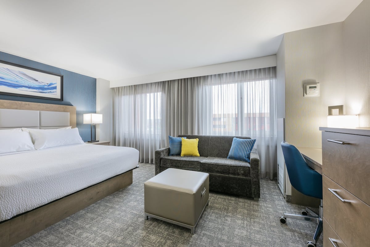 1 bedroom, premium bedding, laptop workspace, blackout curtains