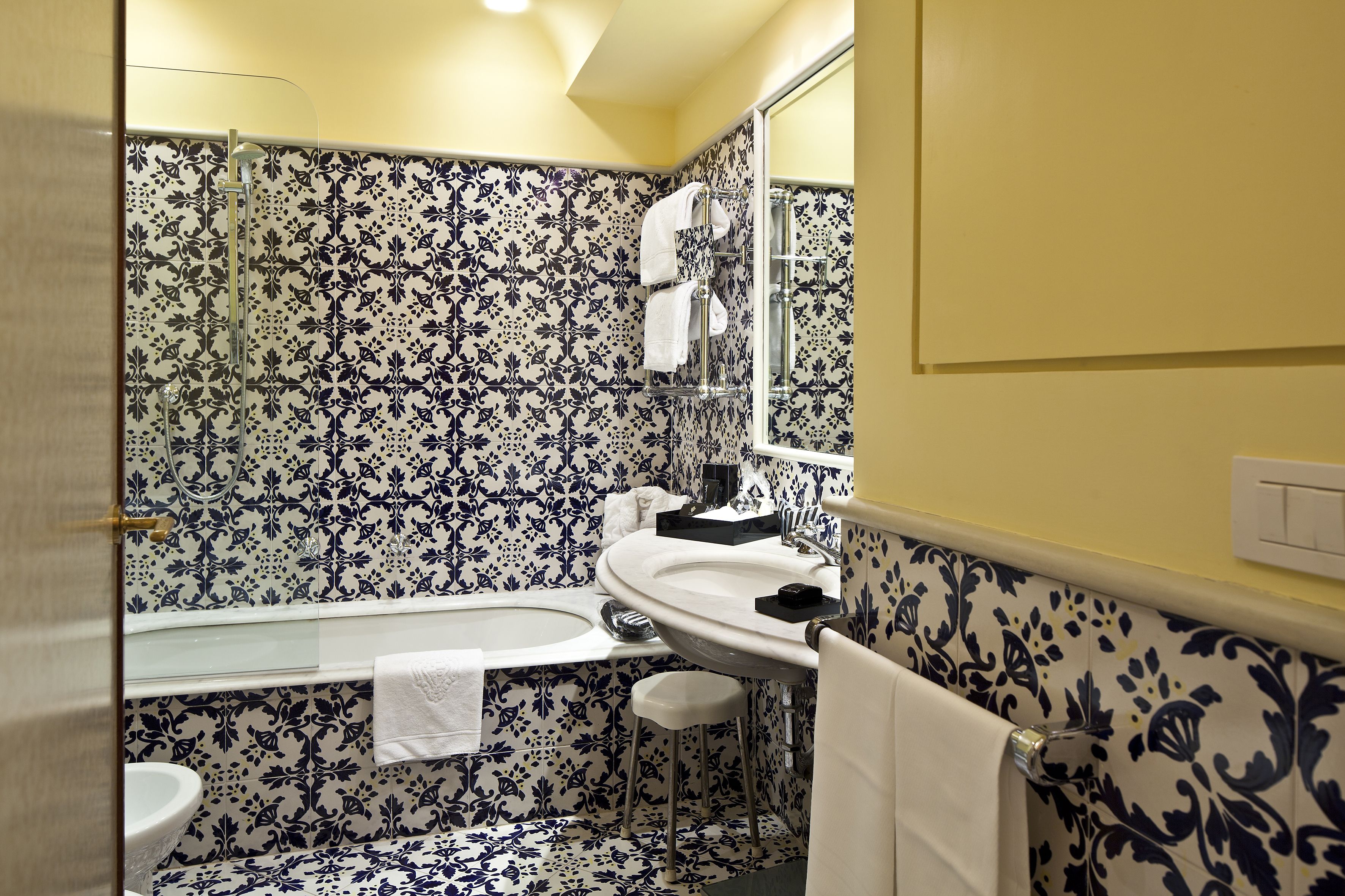 A bathroom with a bathtub, a sink, and a toilet.