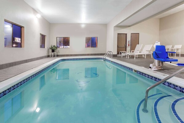 Indoor pool, open 10:00 AM to 10:00 PM, pool loungers