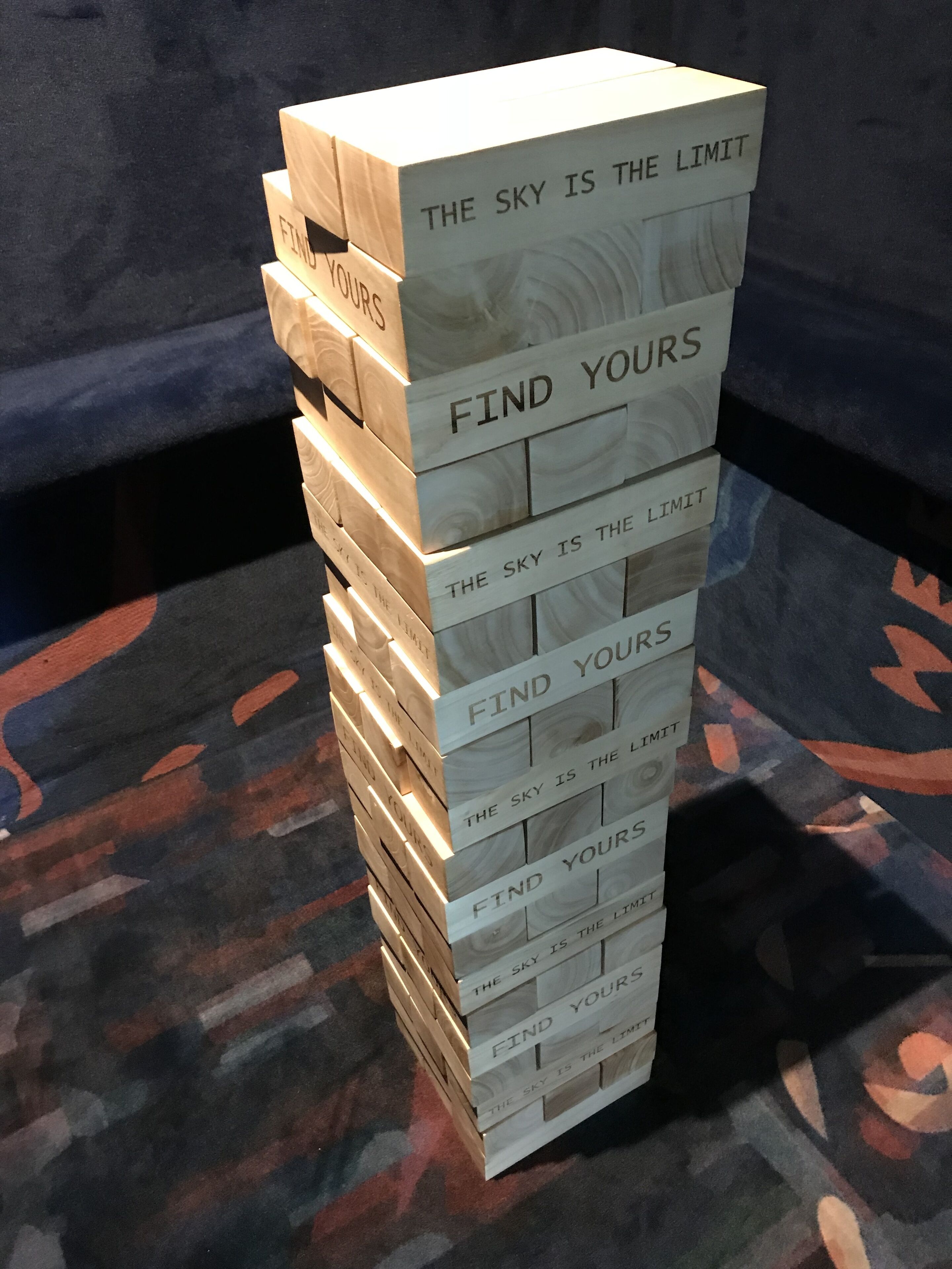 A stack of wooden blocks with motivational phrases.