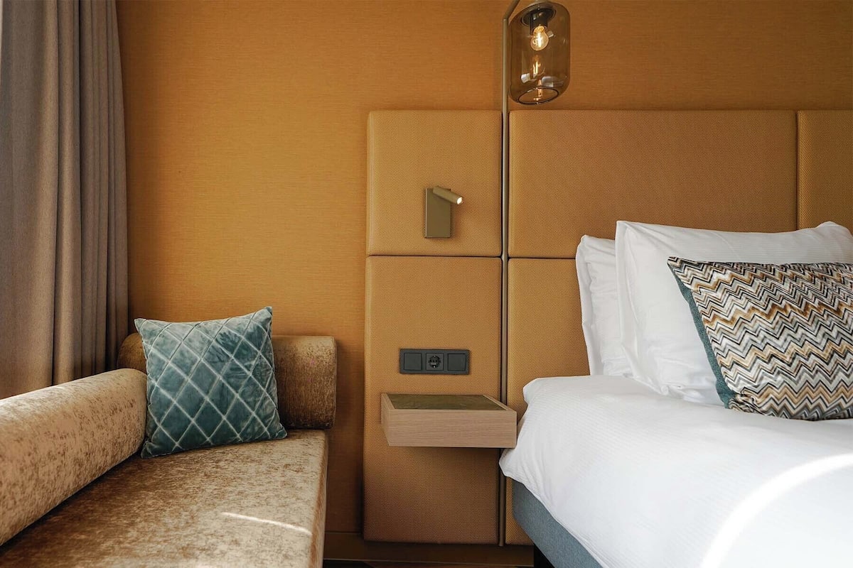 Premium bedding, down duvets, in-room safe, desk