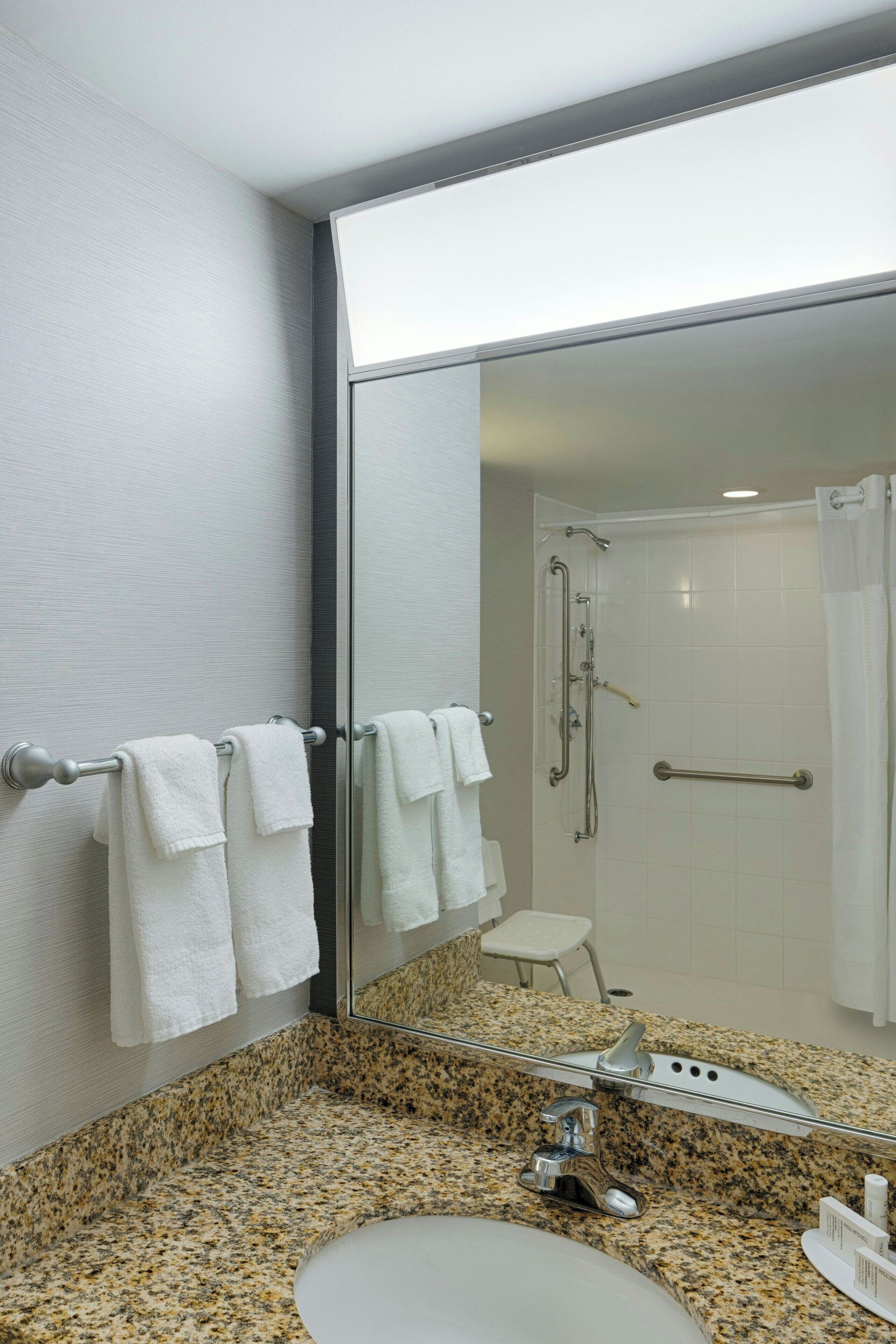 combined shower/bathtub, eco-friendly toiletries, hair dryer, towels