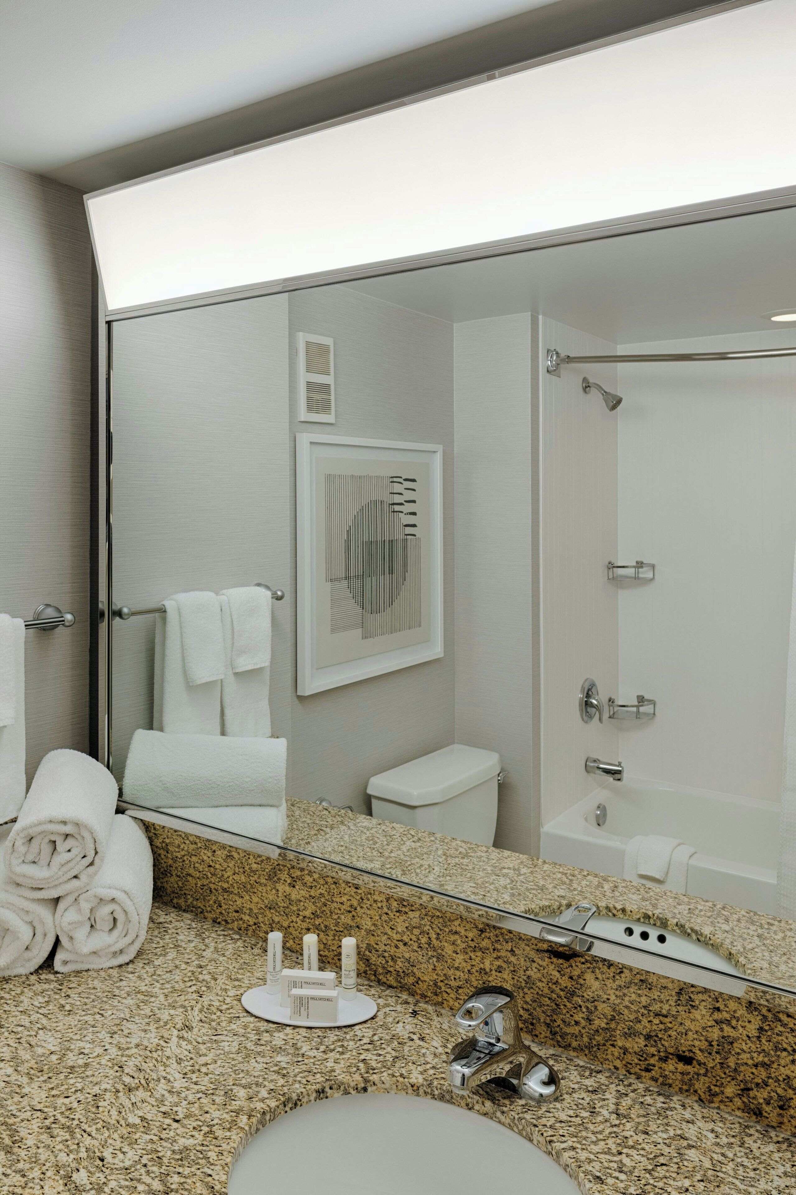 combined shower/bathtub, eco-friendly toiletries, hair dryer, towels