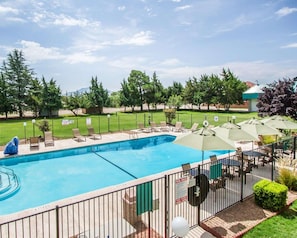 Seasonal outdoor pool, open 9:00 AM to 9:00 PM, pool umbrellas