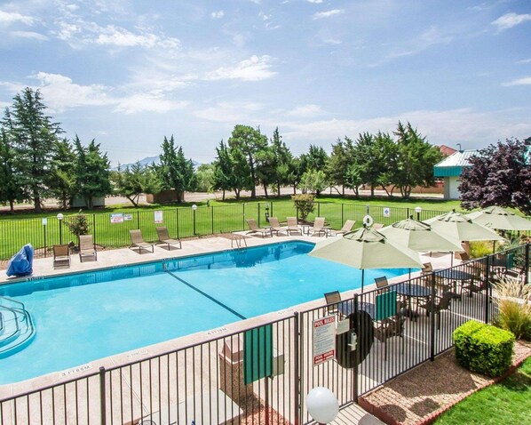 Seasonal outdoor pool, open 9:00 AM to 9:00 PM, pool umbrellas