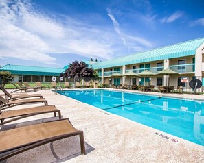 Seasonal outdoor pool, open 9:00 AM to 9:00 PM, pool umbrellas