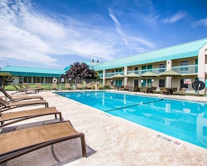 Seasonal outdoor pool, open 9:00 AM to 9:00 PM, pool umbrellas