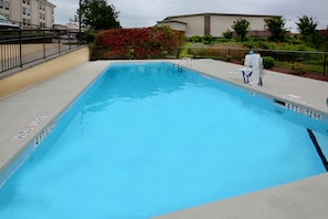 Seasonal outdoor pool, open 9:00 AM to 9:00 PM, pool umbrellas