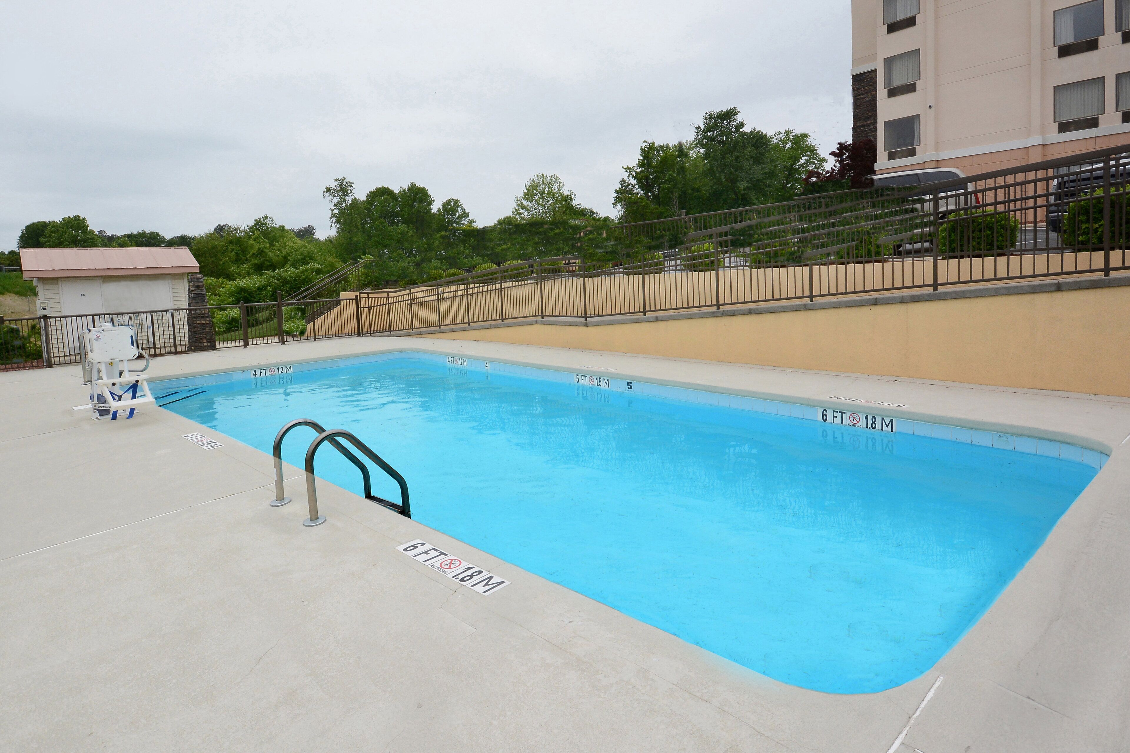 seasonal outdoor pool, open 9:00 am to 9:00 pm, pool umbrellas
