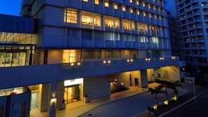 A modern hotel with multiple floors, a prominent entrance, and a well-lit facade. - Naha Tokyu REI Hotel (Naha)