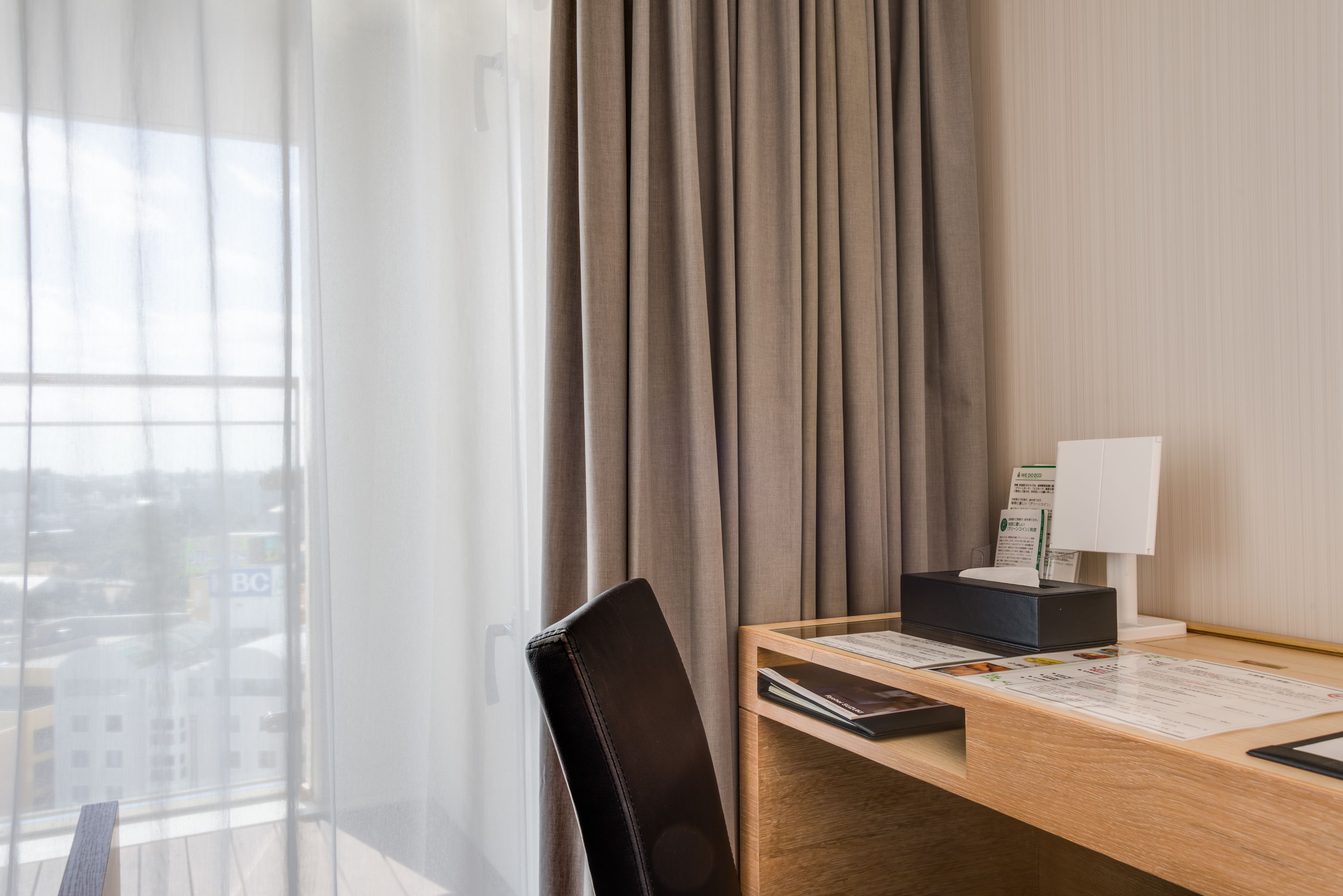 premium bedding, desk, laptop workspace, blackout curtains