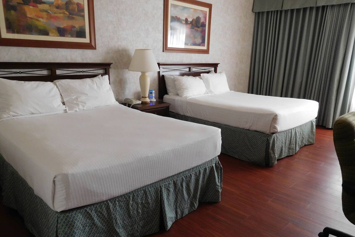 pillow-top beds, desk, blackout curtains, iron/ironing board