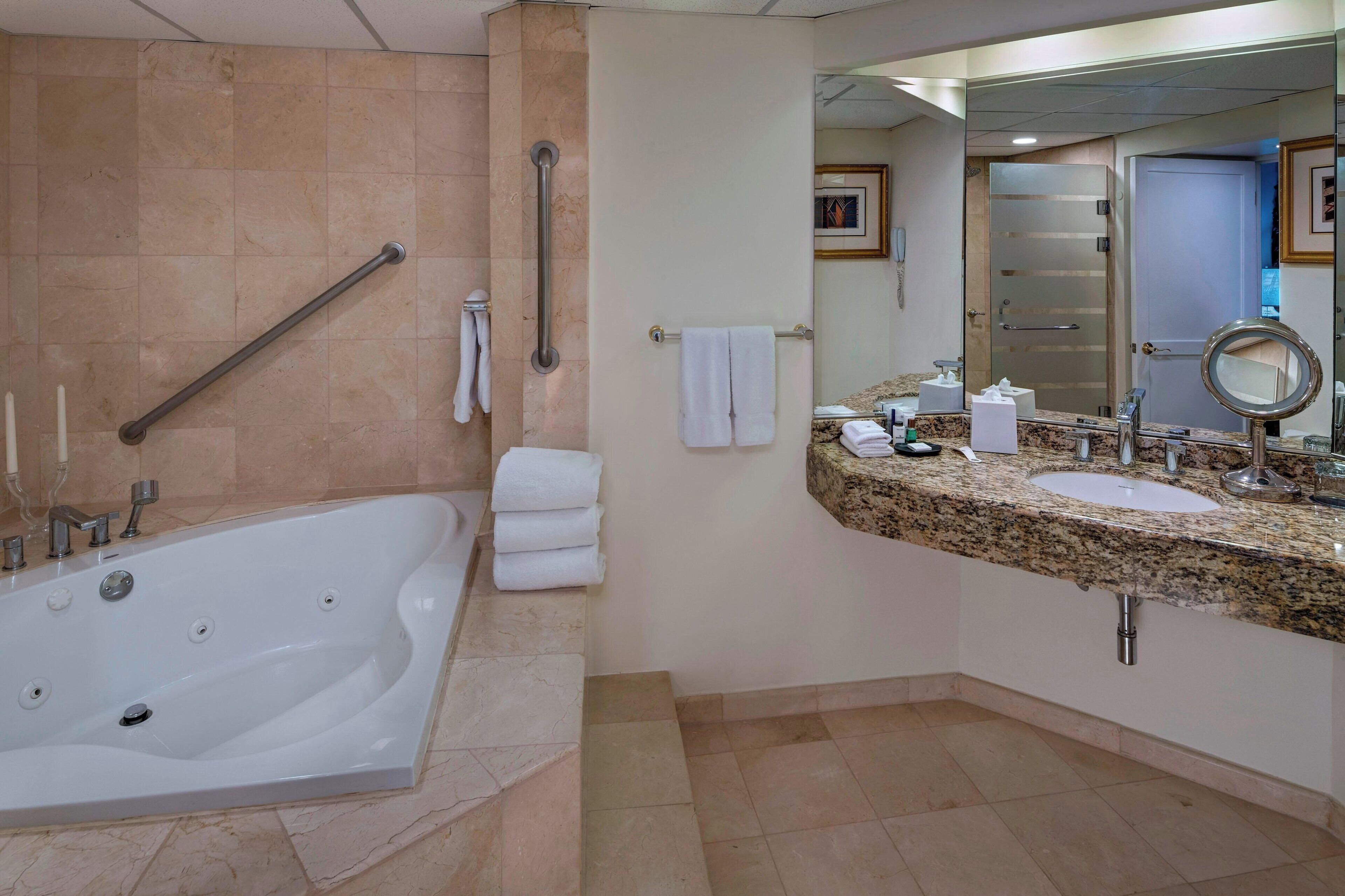 presidential suite, 1 king bed, garden view | bathroom | deep-soaking bathtub, free toiletries, hair dryer, towels