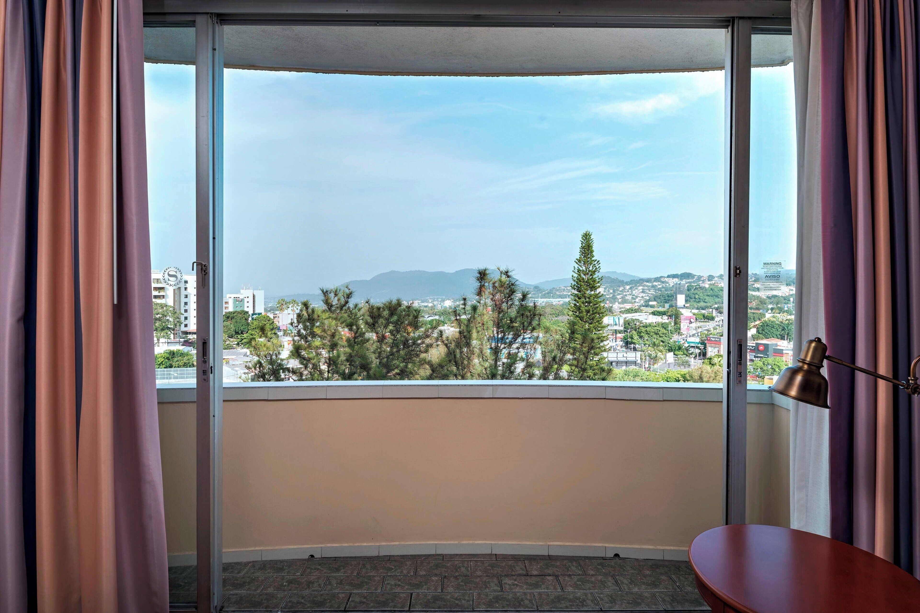 deluxe room, 2 queen beds, balcony | premium bedding, minibar, in-room safe, desk