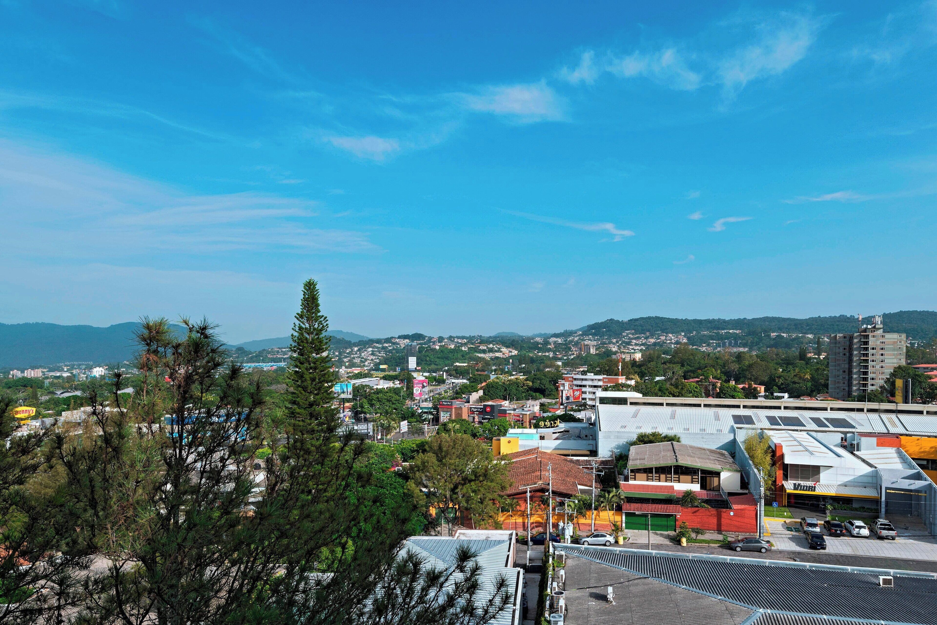 deluxe room, 2 queen beds, balcony | premium bedding, minibar, in-room safe, desk