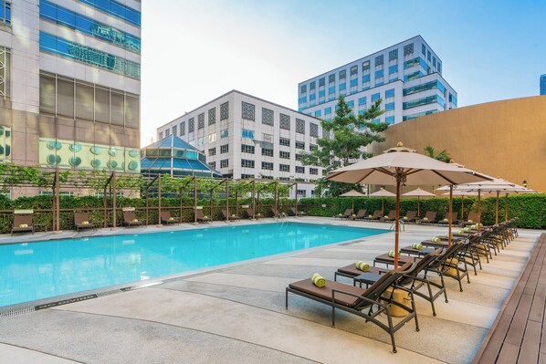 Outdoor pool, pool umbrellas, sun loungers