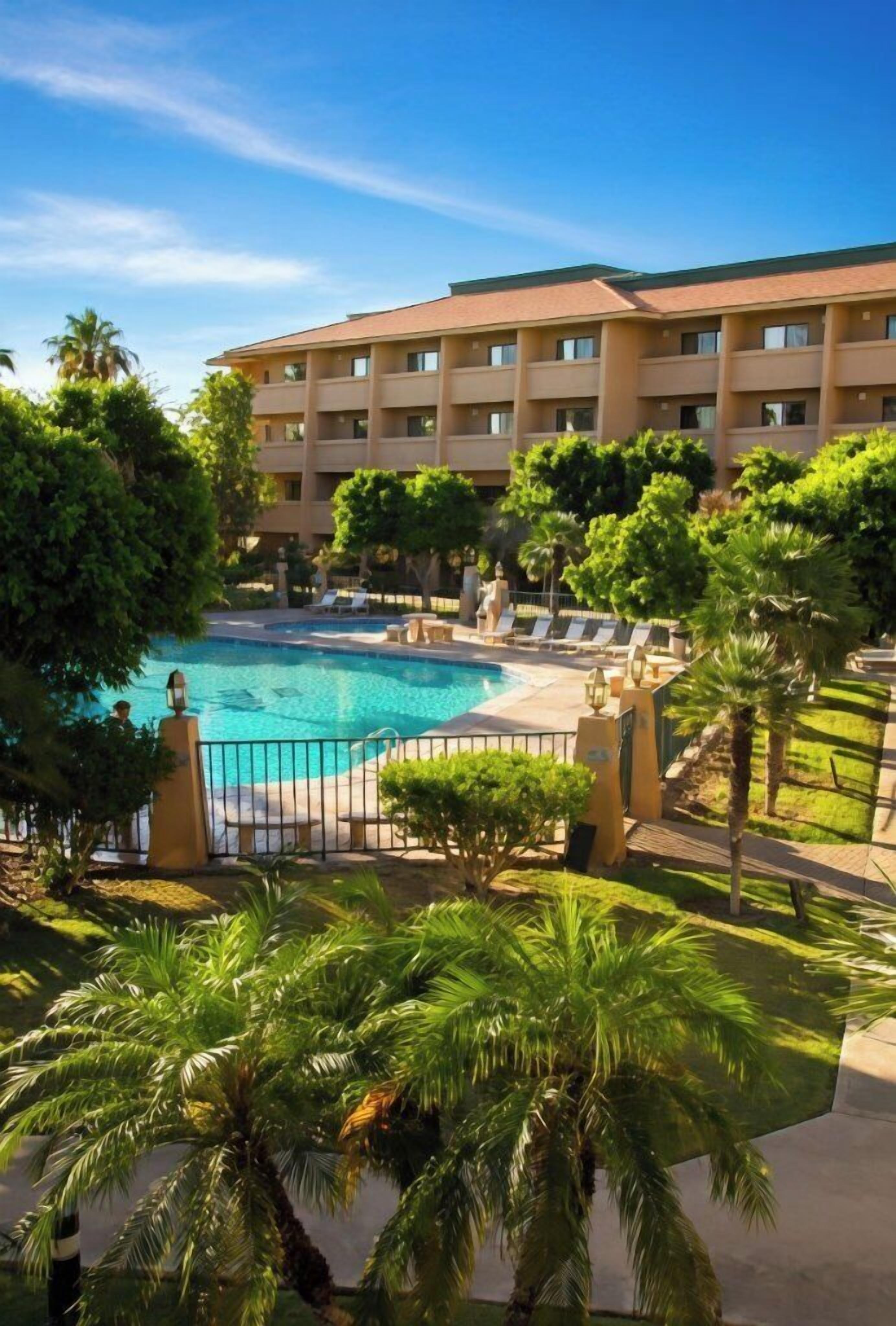 Outdoor pool, pool umbrellas, sun loungers