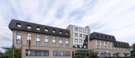 A modern building with multiple windows and a flat roof.