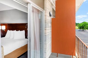 Deluxe Room, 2 Queen Beds, Non Smoking | In-room safe, desk, laptop workspace, blackout drapes