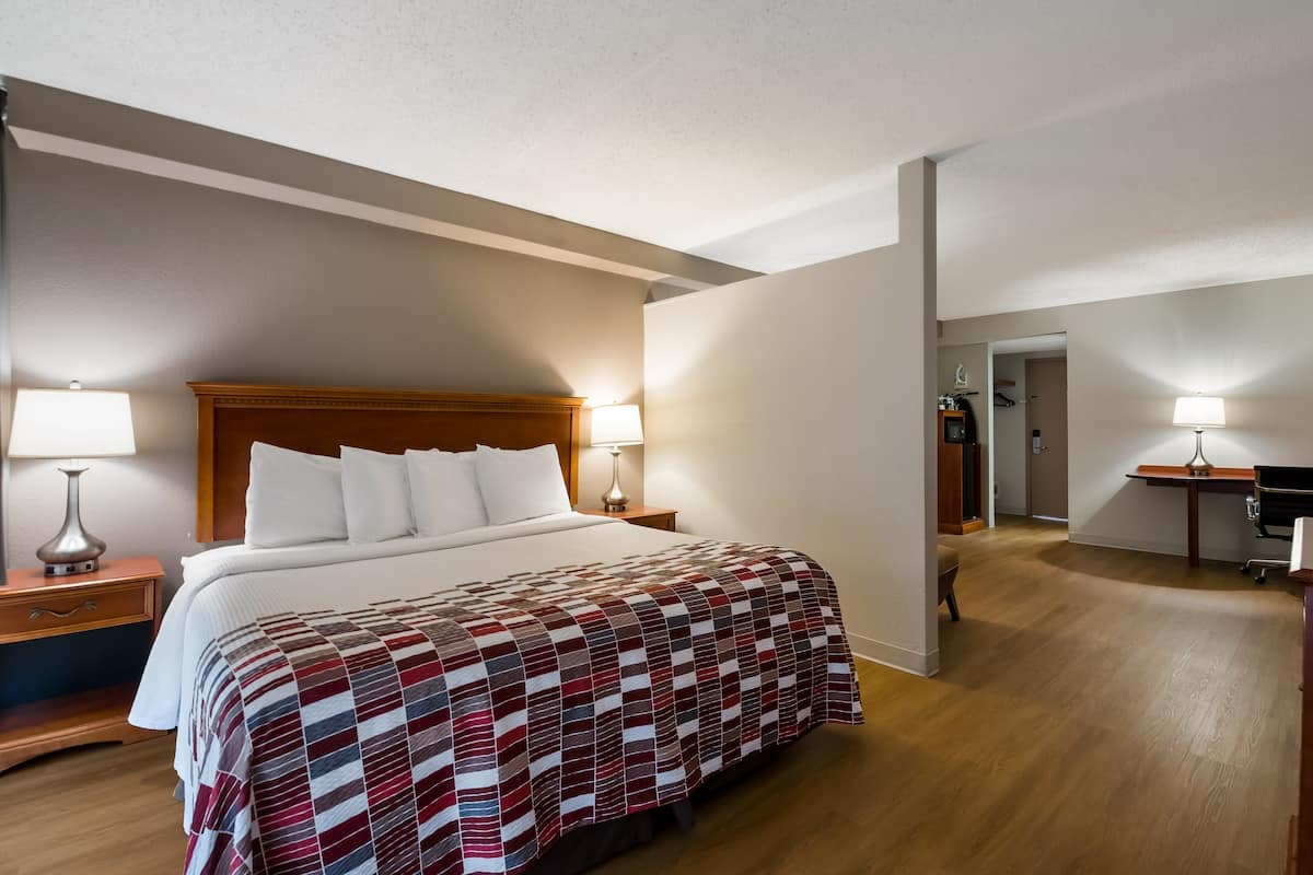Premium bedding, blackout curtains, iron/ironing board