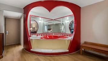 Suite, 1 King Bed, Non Smoking, Jetted Tub | Premium bedding, blackout drapes, iron/ironing board