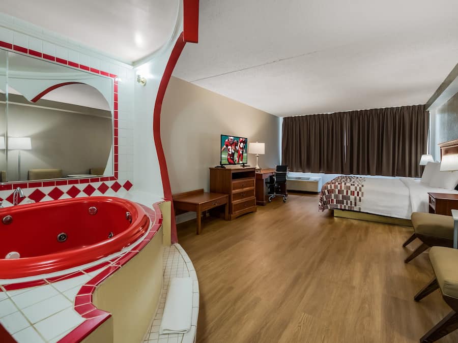 Suite, 1 King Bed, Non Smoking, Jetted Tub | Premium bedding, blackout drapes, iron/ironing board