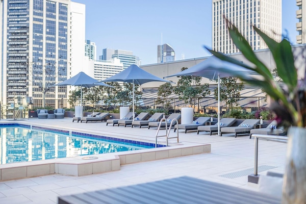 Outdoor pool, open 6:00 AM to 9:00 PM, pool umbrellas, pool loungers