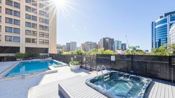 Outdoor pool, open 6:00 AM to 9:00 PM, pool umbrellas, pool loungers
