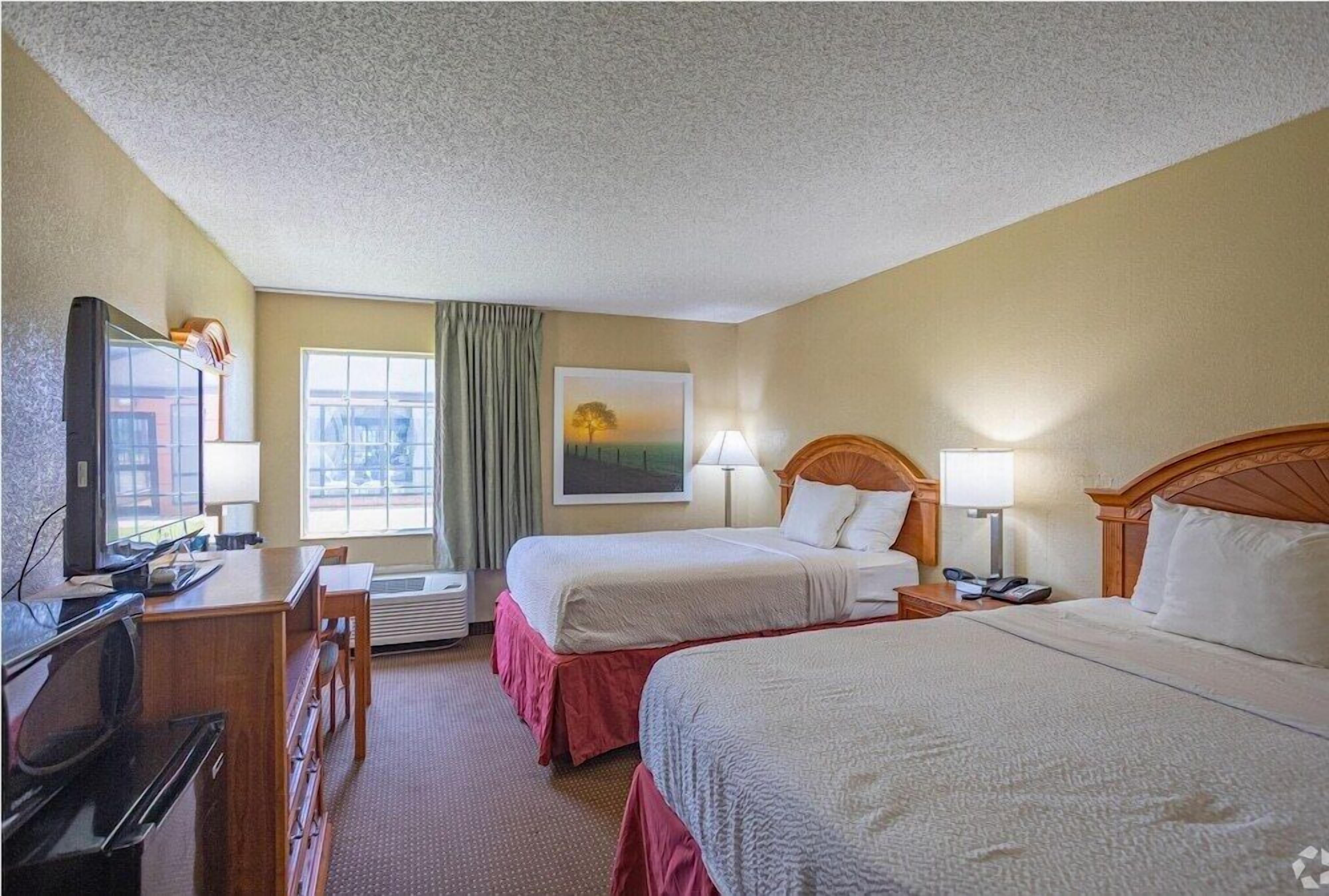 Pillow-top beds, laptop workspace, blackout curtains, free WiFi