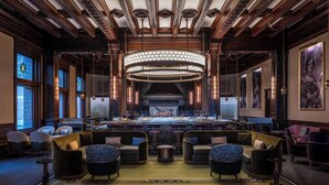 A spacious lobby with a grand chandelier, comfortable seating, and a fireplace. - Fairmont Empress (Victoria)