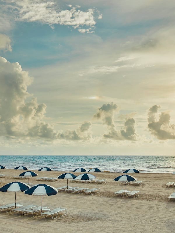 Private beach, white sand, sun loungers, beach umbrellas