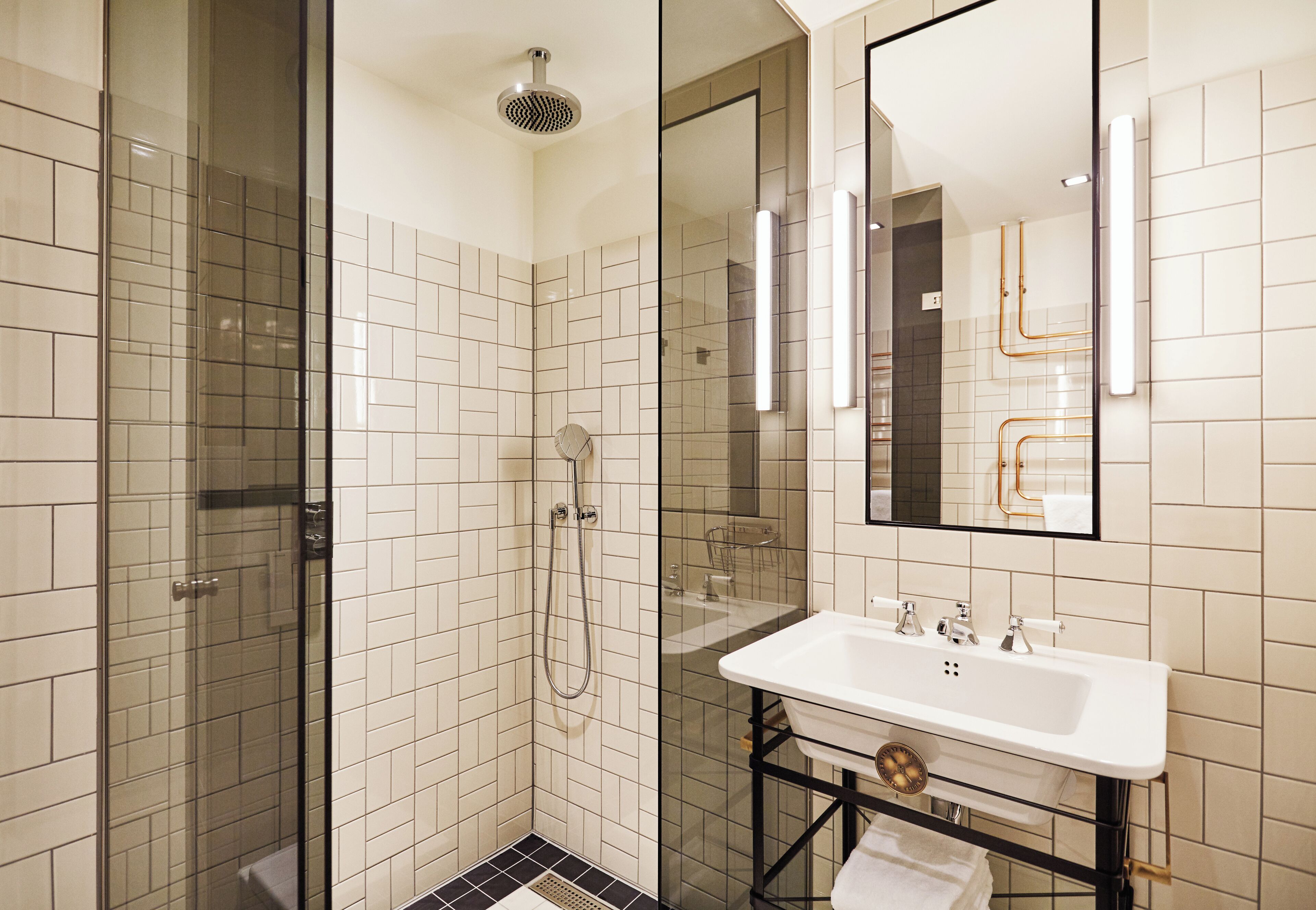 rainfall showerhead, designer toiletries, hair dryer, towels