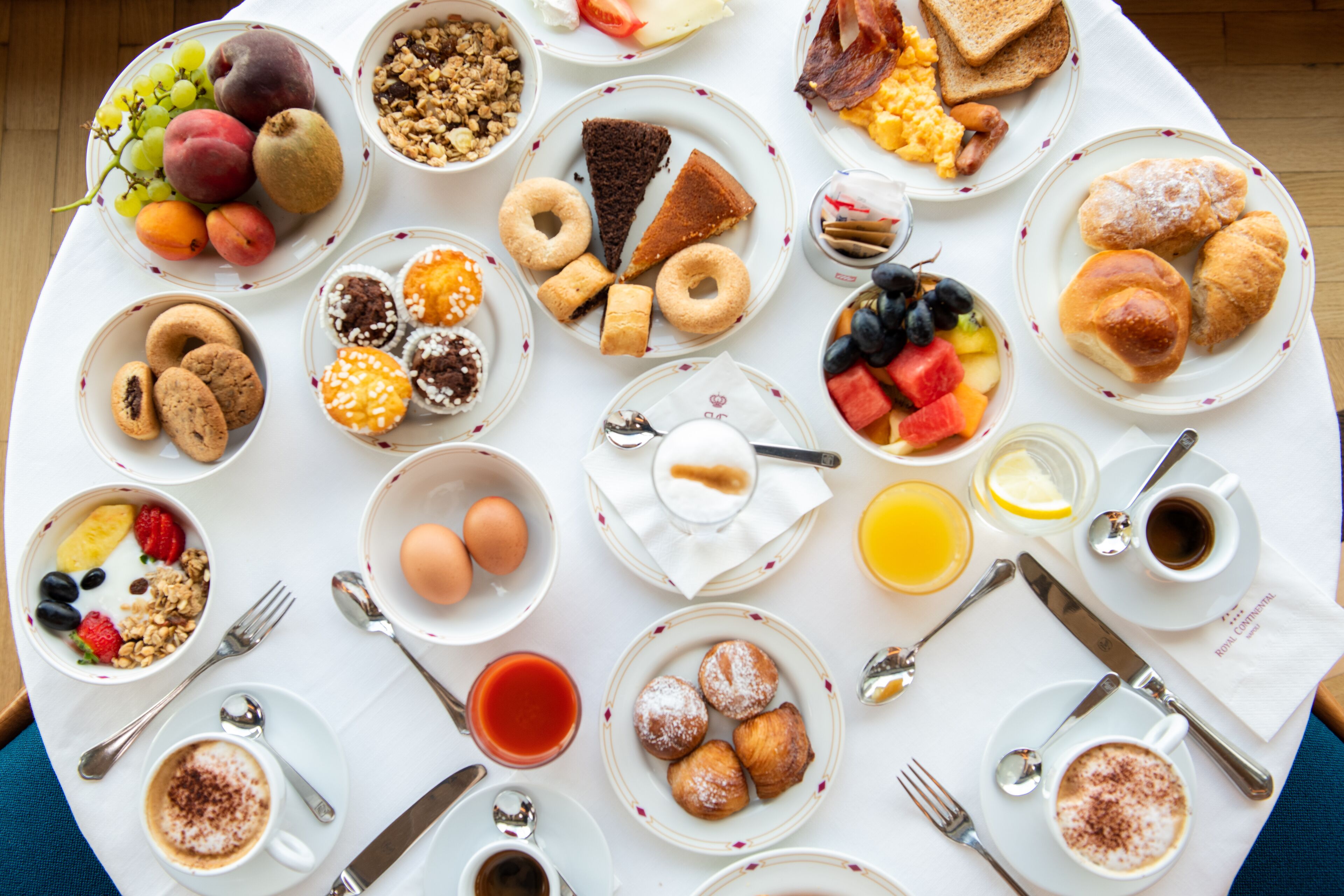 A breakfast buffet with various food items and beverages.
