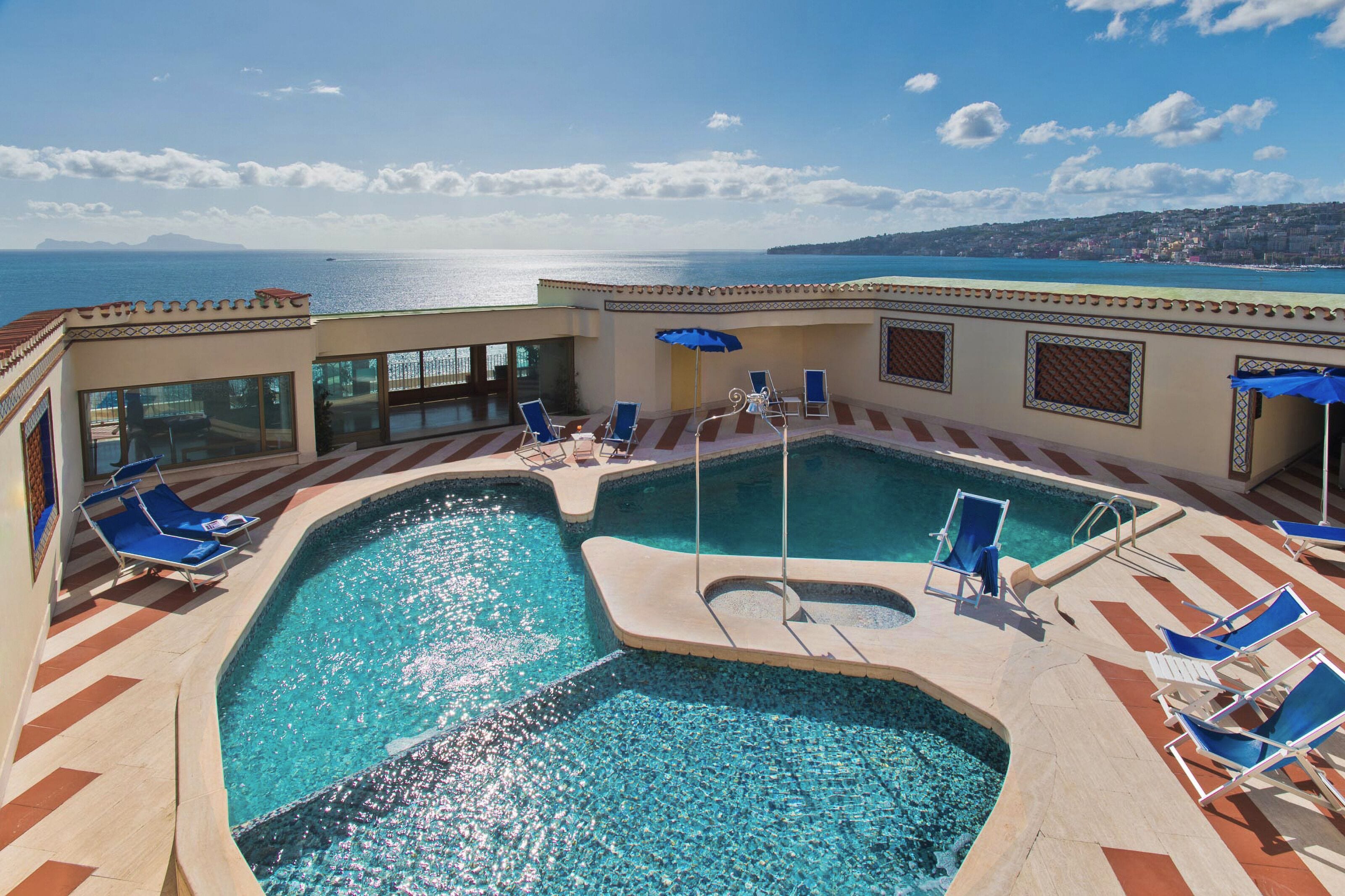 seasonal outdoor pool, pool umbrellas, pool loungers