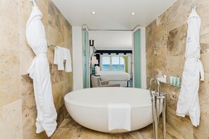 Suite, Oceanfront | Bathroom | Separate tub and shower, designer toiletries, hair dryer, bathrobes