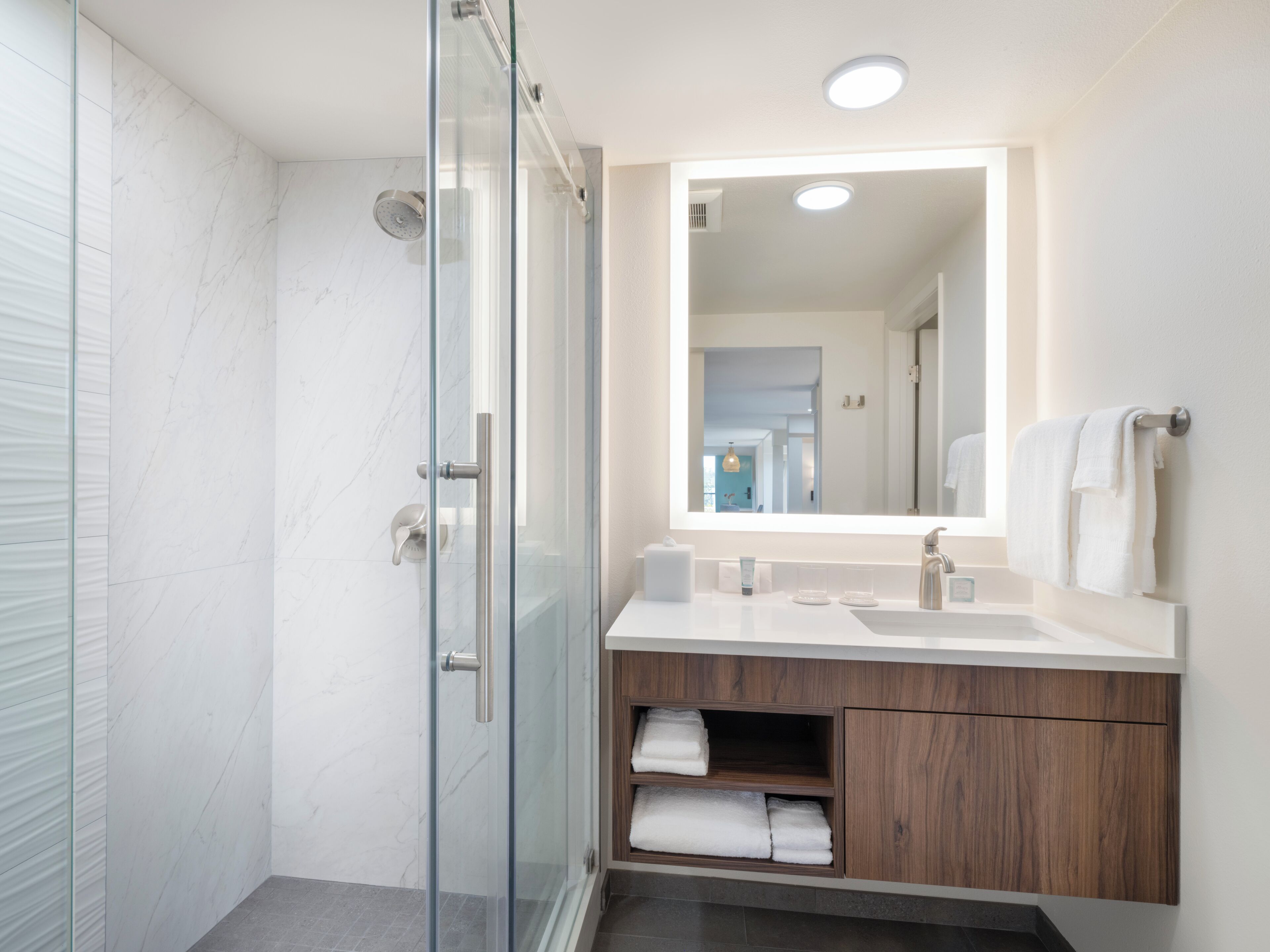 combined shower/bathtub, designer toiletries, hair dryer, bathrobes