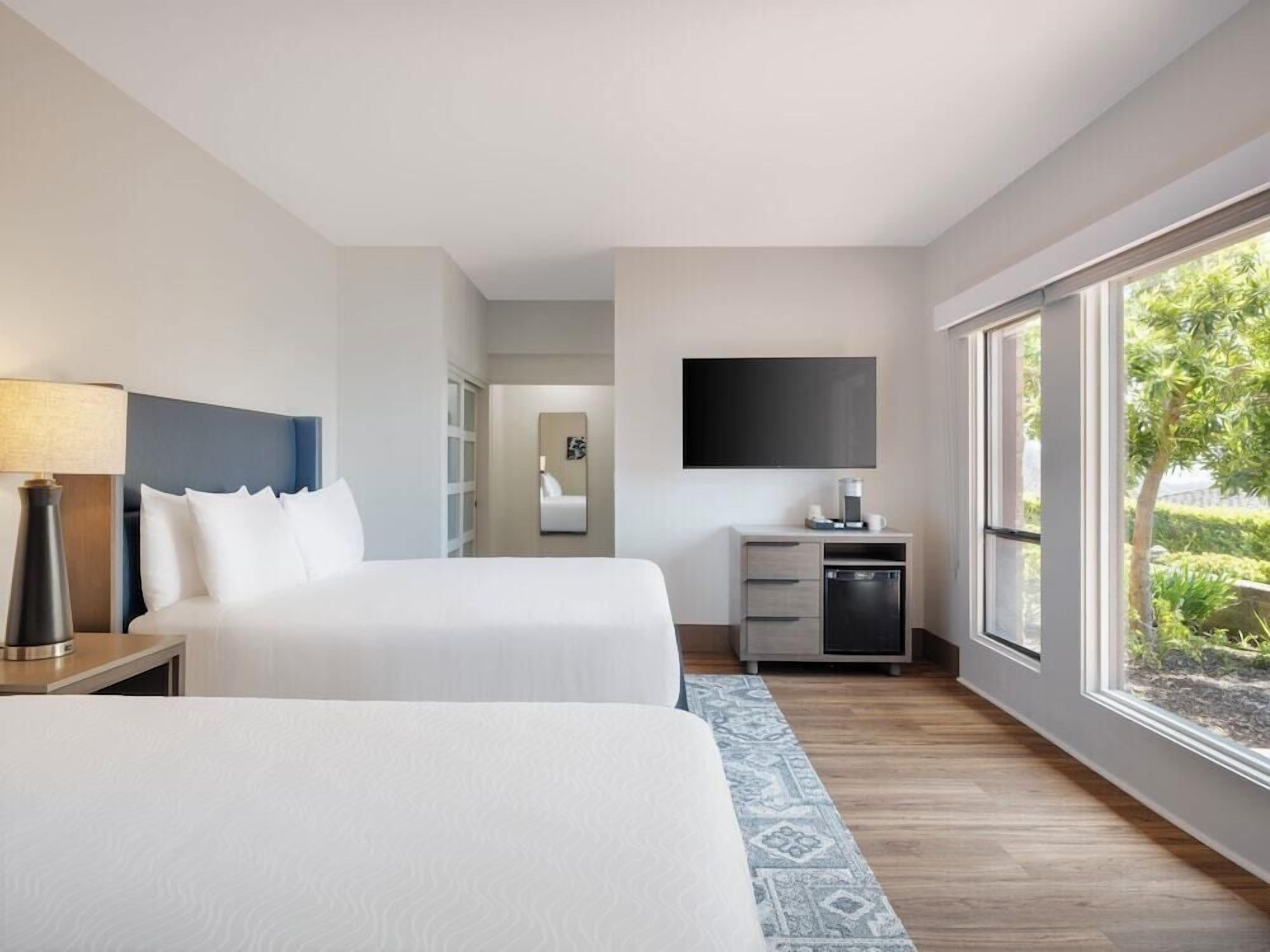Premium bedding, down comforters, pillowtop beds, in-room safe