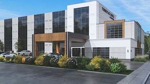 A modern building with large windows, a parking lot, and a sign that reads "TOOMEPLACE SUITES." - TownePlace Suites by Marriott Niagara Falls Canada (Niagara Falls)