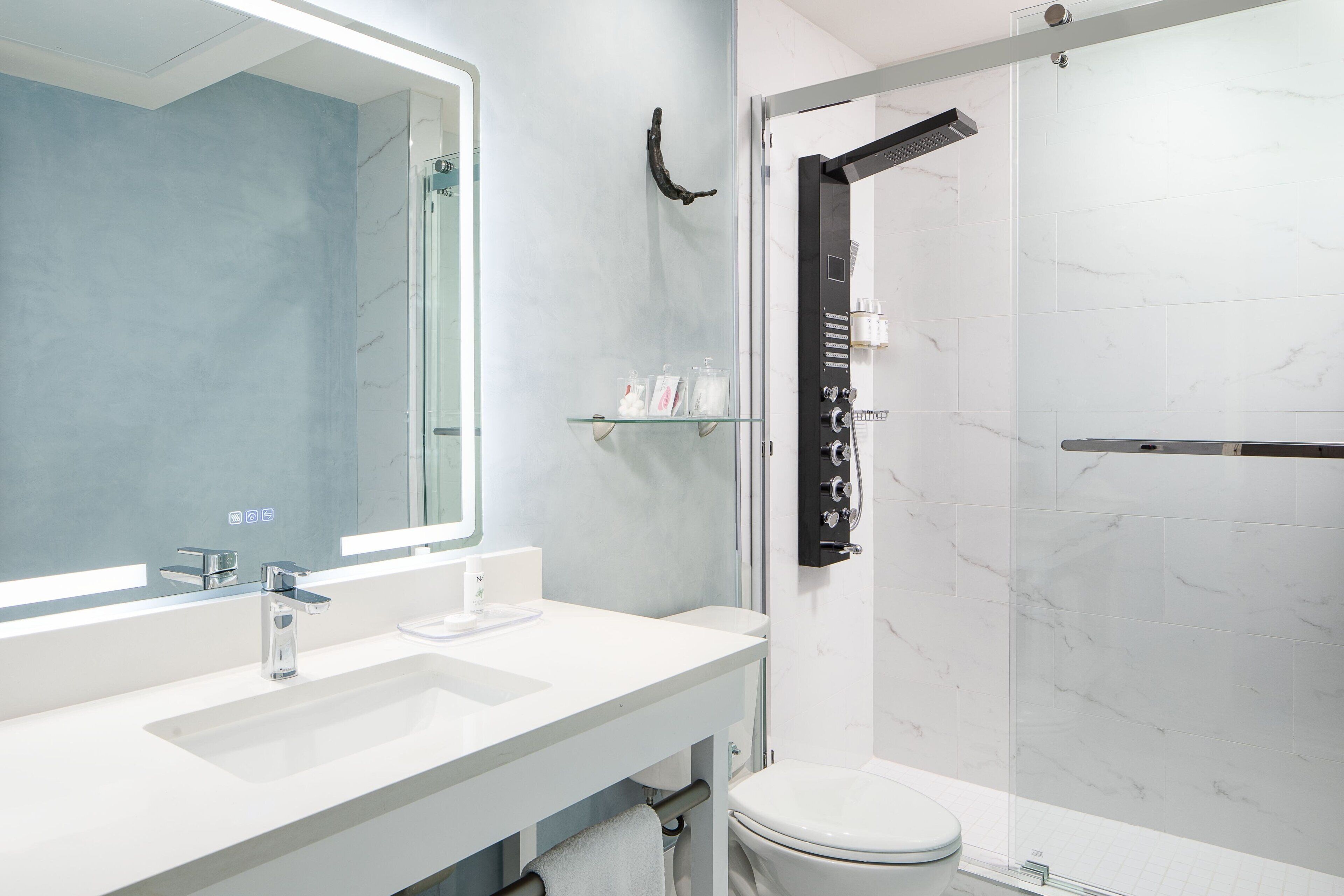 combined shower/bathtub, designer toiletries, hair dryer, bathrobes