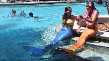 Guests can enjoy a refreshing swim in the pool surrounded by lounge chairs.