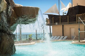 Outdoor pool, open 8:00 AM to 10:00 PM, pool loungers - Days Inn by Wyndham Panama City Beach/Beachfront Resort  (Panama City Beach)