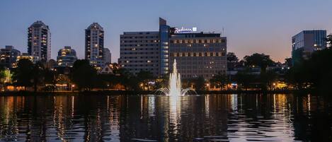A cityscape with a prominent building labeled "Radisson" across the water.