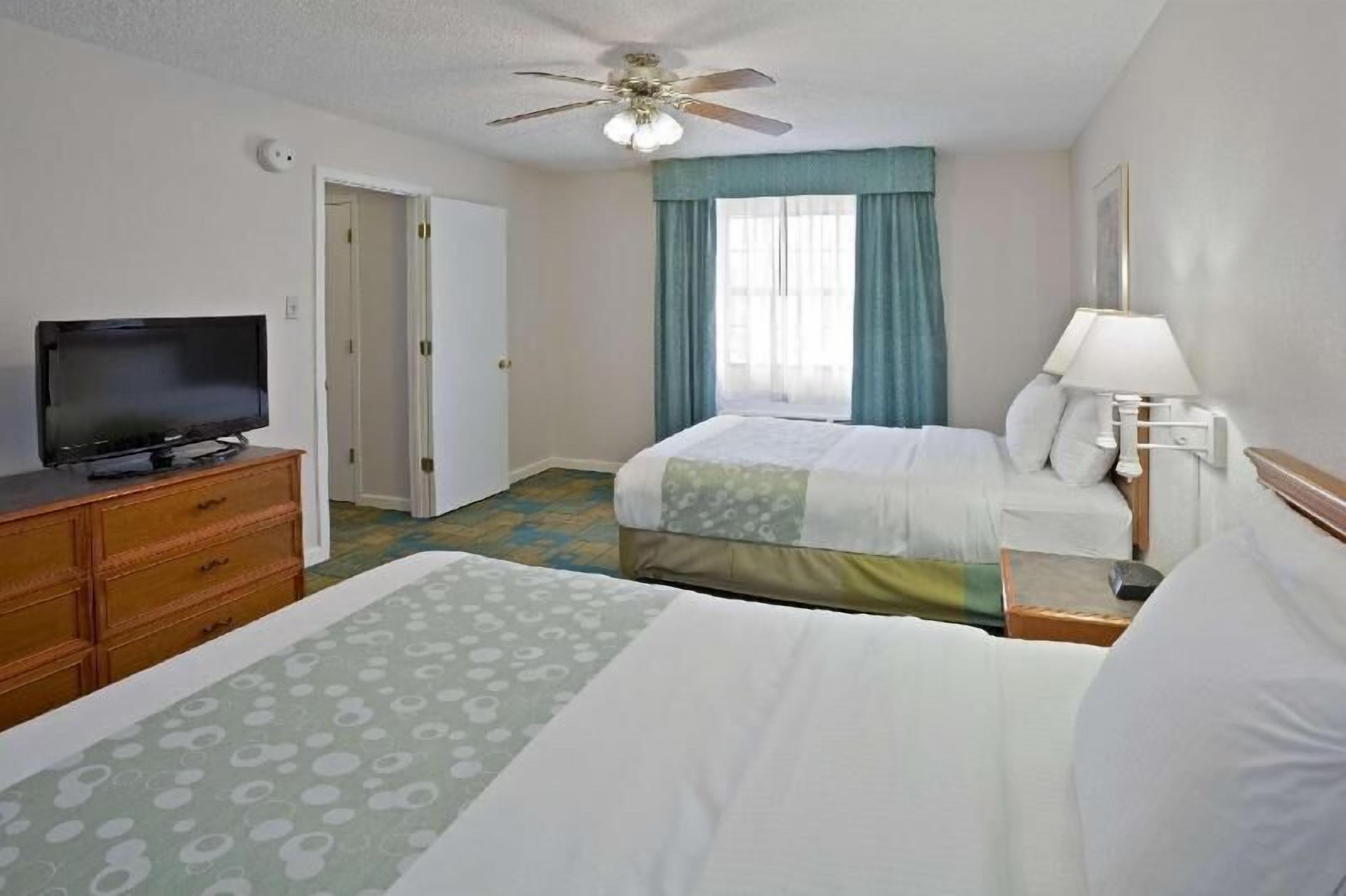 Premium bedding, pillow-top beds, desk, laptop workspace