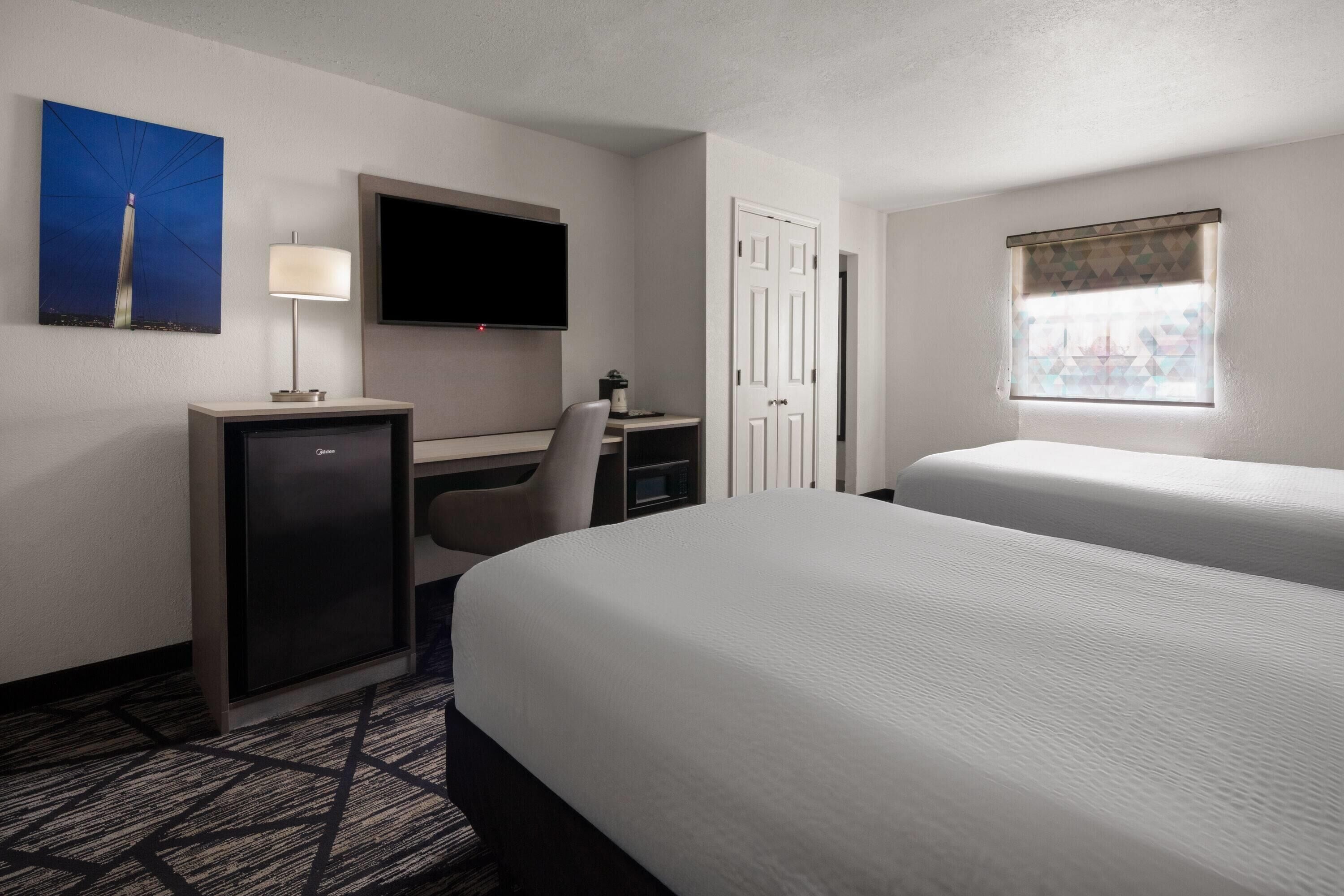 Premium bedding, pillowtop beds, desk, laptop workspace