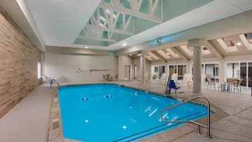 Indoor pool, open 9:00 AM to 9:00 PM, pool loungers